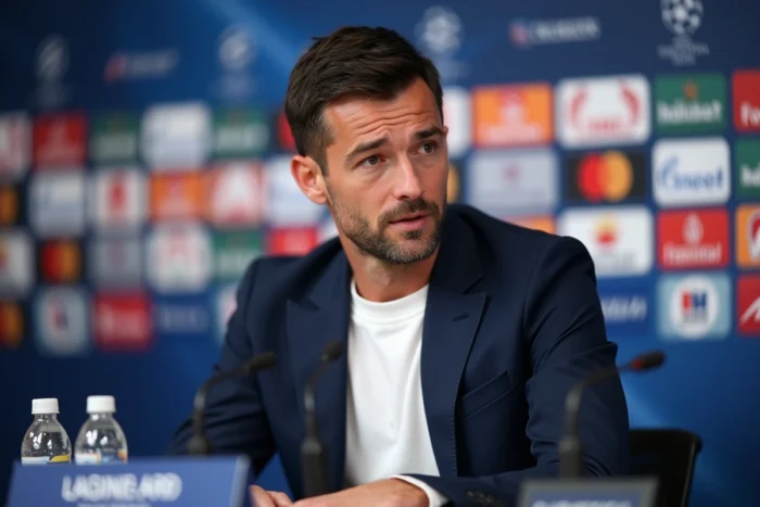 Footballeur en conférence de presse officielle dans un stade moderne, évoquant les révélations sur le club actuel d'Eden Hazard en 2026